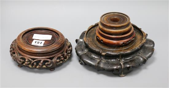 A collection of Chinese wood stands largest diameter 24cm